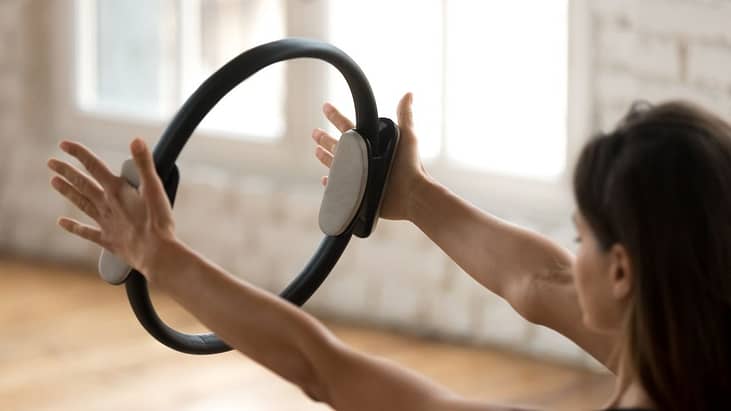 Pilates Instructor exercising with pilates ring